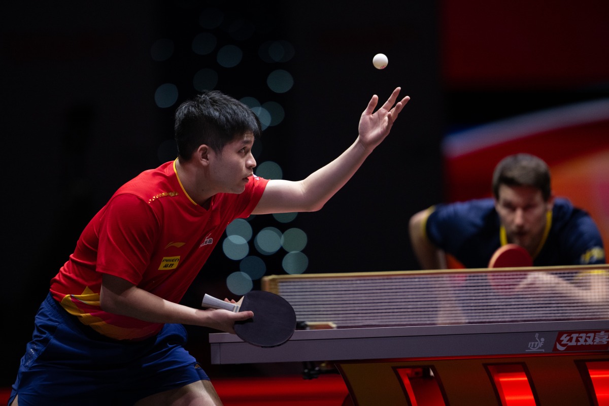 China's Lin Shidong serves to Kristian Karlsson of Sweden. Pic: Xinhua