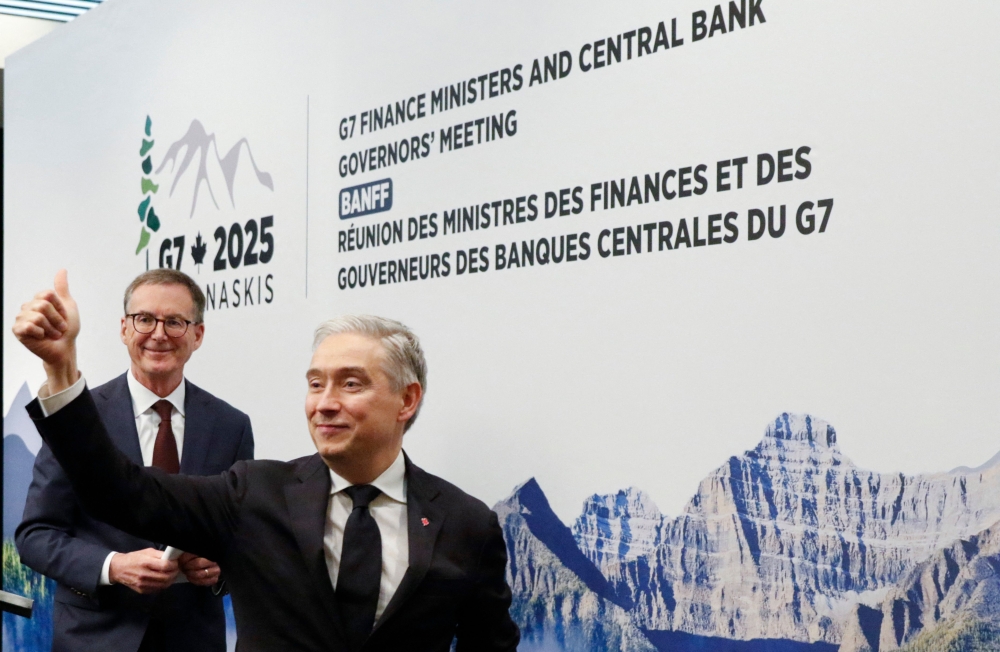 Tiff Macklem (left) Governor of the Bank of Canada and Fracois-Philippe Champagne, Canada's Minister of Finance and National Revenue gesture after their closing press conference during the G7 Finance Ministers and Central Bank Governors’ Meeting in Banff, Alberta, Canada on May 22, 2025. (Photo by Dave Chidley / AFP)

