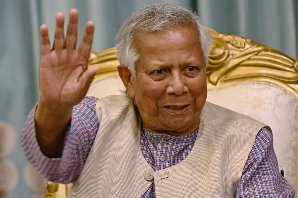 (Files) Nobel laureate and Chief adviser of Bangladesh's new interim government Muhammad Yunus, gestures as he meets relatives of people who went missing during the tenure of ousted Prime Minister Sheikh Hasina, in Dhaka on August 13, 2024.  (Photo by Indranil Mukherjee / AFP)

