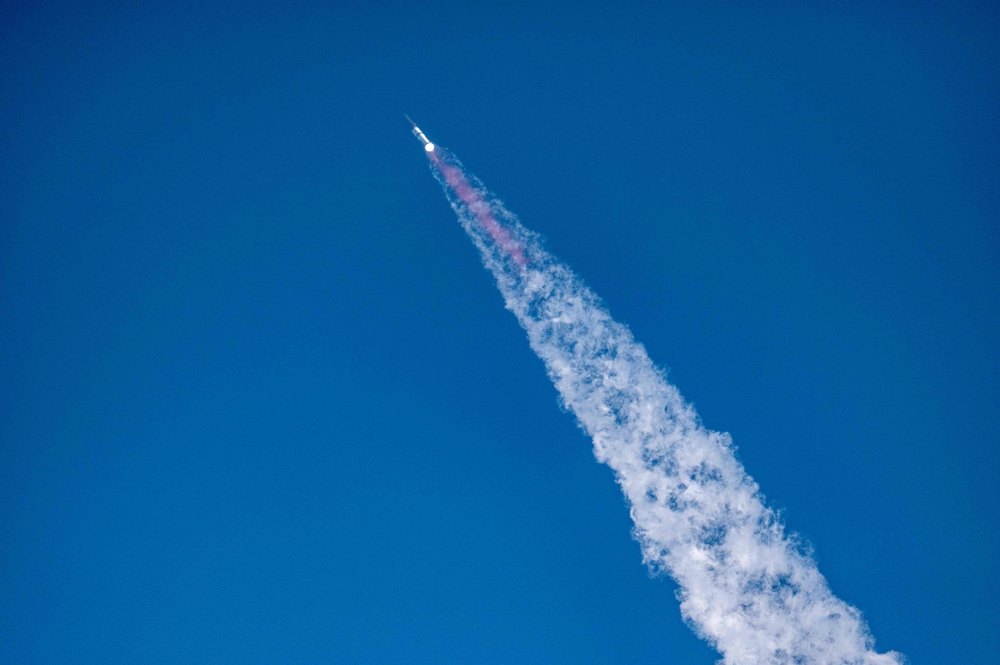 The SpaceX Starship rocket launches from Starbase, Texas, as seen from South Padre Island on May 27, 2025. (Photo by Sergio Flores / AFP)