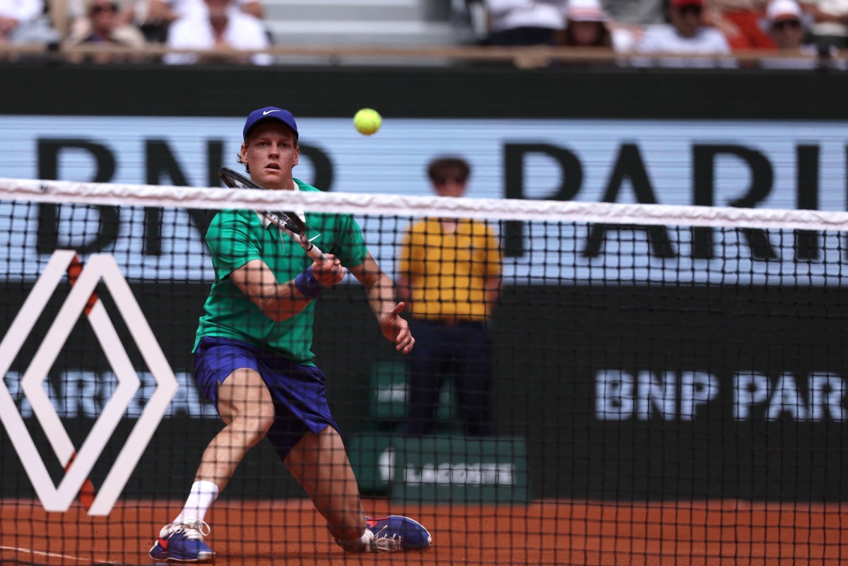 Italy's Jannik Sinner hits a volley to France's Richard Gasquet during their men's singles match on day 5 of the French Open tennis tournament on Court Philippe-Chatrier at the Roland-Garros Complex in Paris on May 29, 2025. (Photo by Alain JOCARD / AFP