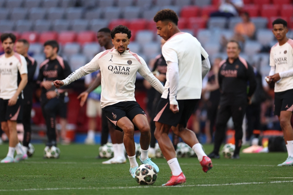 Paris Saint-Germain's Brazilian defender #5 Marquinhos (left) closes down Paris Saint-Germain's French midfielder #14 Desire Doue during the MD-1 training session on the eve of the UEFA Champions League final football match between Inter Milan and Paris Saint-Germain (PSG) in Munich, southern Germany, on May 30, 2025. (Photo by Franck Fife / AFP)