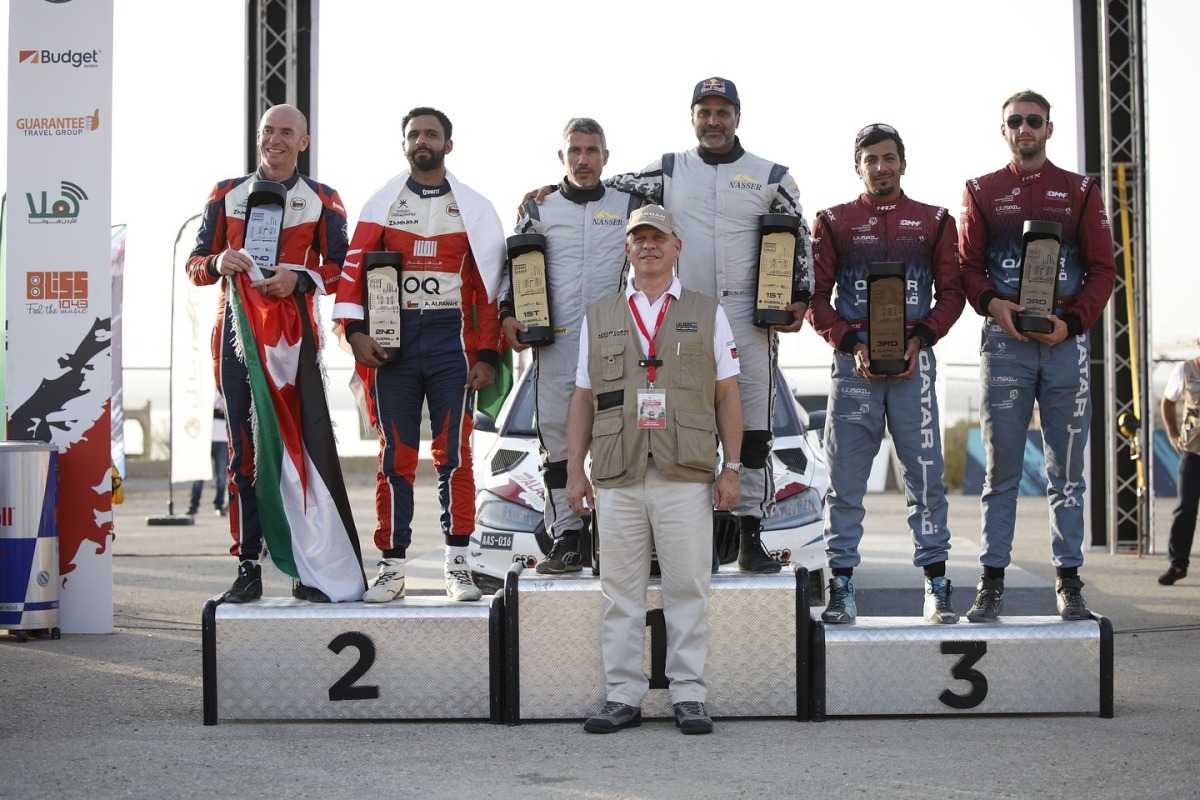 Qatar's Nasser Saleh Al Attiyah with his co-driver Candido Carrera celebrates on the podium after winning the Jordan Rally.  Abdullah Al Rawahi of Oman and Ata Al Hmoud of Jordan came second while Qatar's Abdulaziz Al Kuwari  and Irish co-driver Lorcan Moore secured third place. 