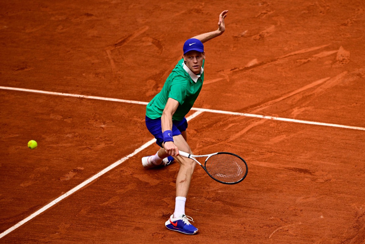 Italy’s Jannik Sinner plays a return to Czech Republic’s Jiri Lehecka.