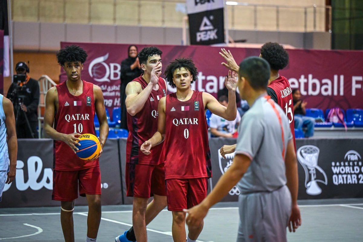 Qatar players celebrate after winning a match.