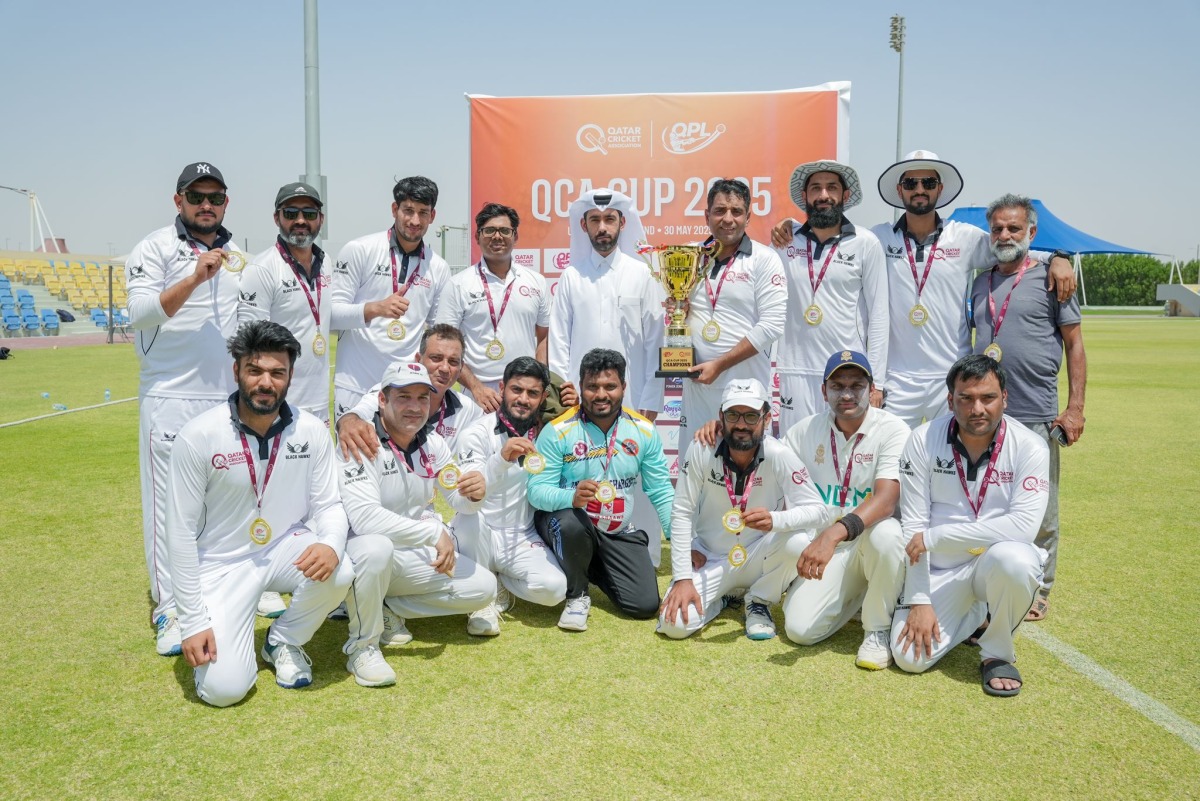 QCA Domestic Cricket Director Abdullah Al Abdullah poses for a photo with the victorious Black Hawks players and officials.