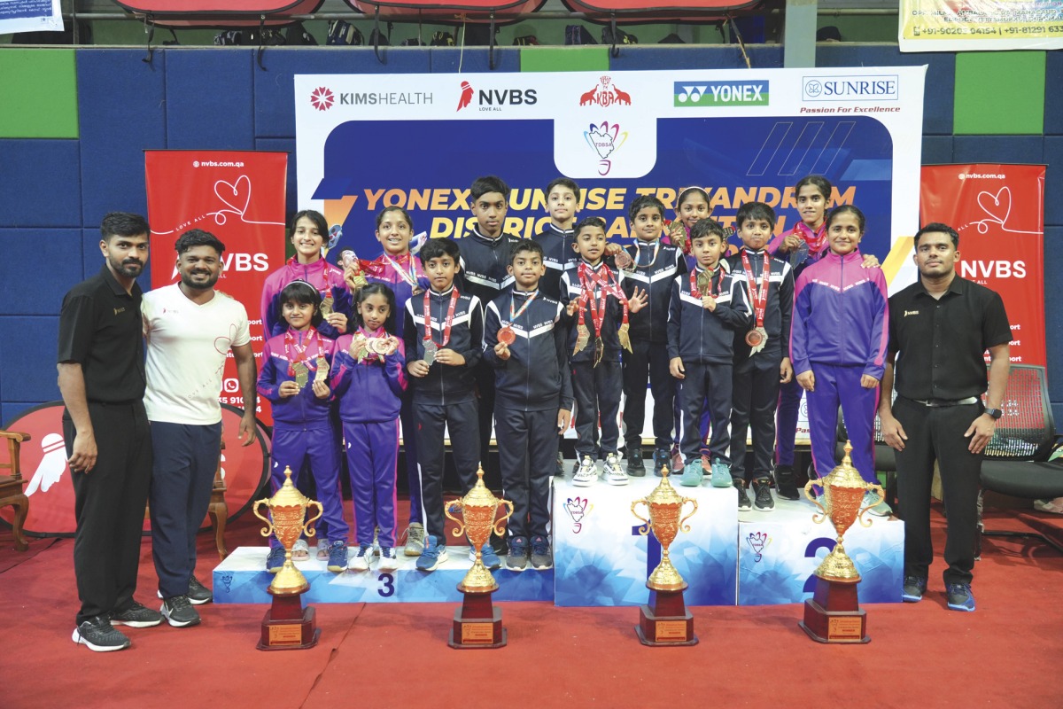 NVBS players participated in Trivandrum District Badminton Championship 2025 posing along with the Coaches.