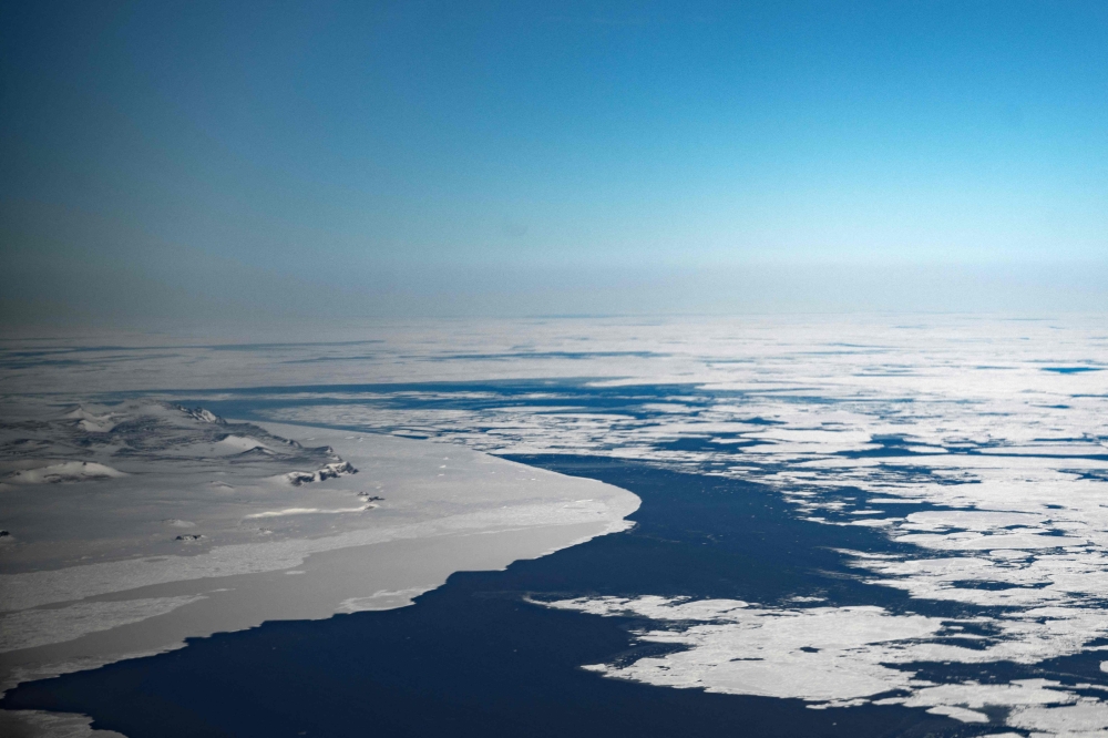 This pictures shows the sea ice melting on April 23, 2024 near Ittoqqortoormiit, Eastern Greenland. (Photo by Olivier Morin / AFP)