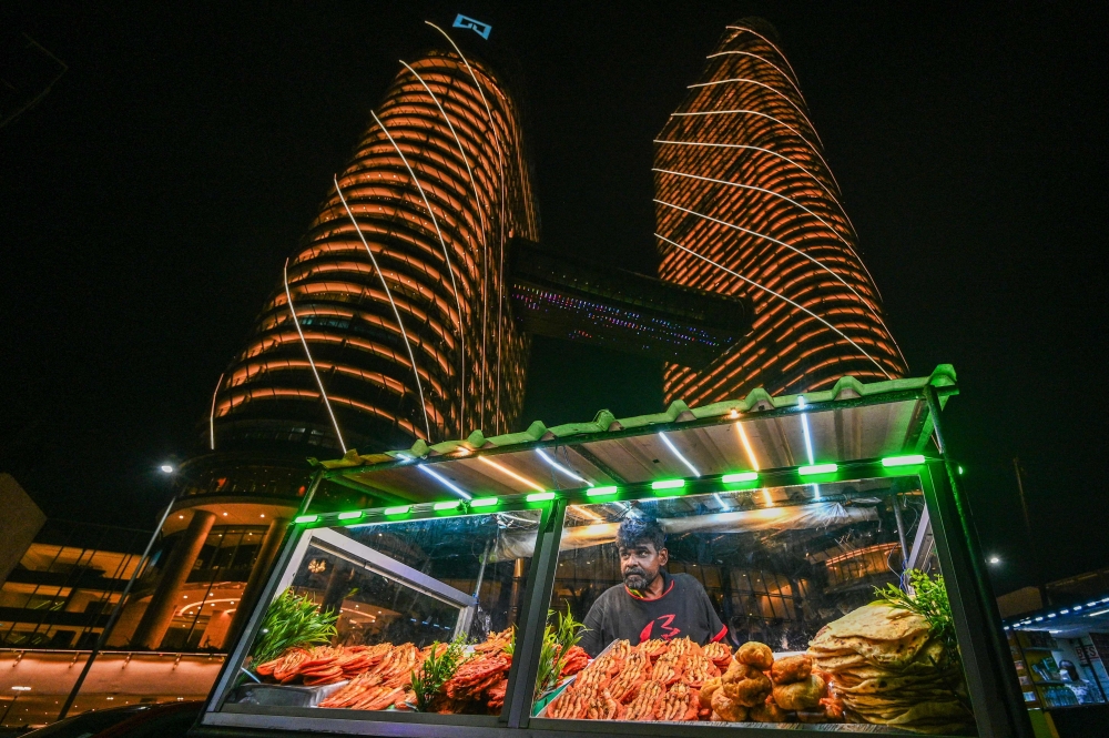File: A street vendor sells prawns at the Galle Face sea-front promenade in Colombo on March 15, 2024. (Photo by Ishara S Kodikara / AFP)


