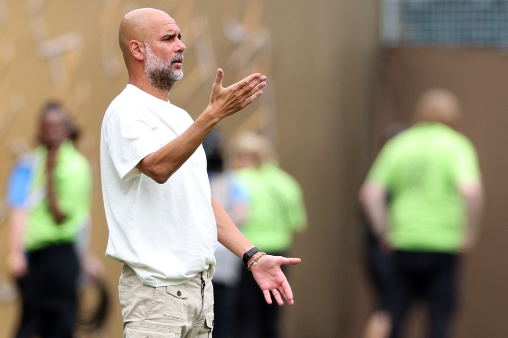 Manchester City's Spanish head coach Pep Guardiola during the FIFA Club World Cup 2025 Group G football match between England's Manchester City and Morocco's Wydad AC at the Lincoln Financial Field stadium in Philadelphia on June 18, 2025. (Photo by Charly Triballeau / AFP)