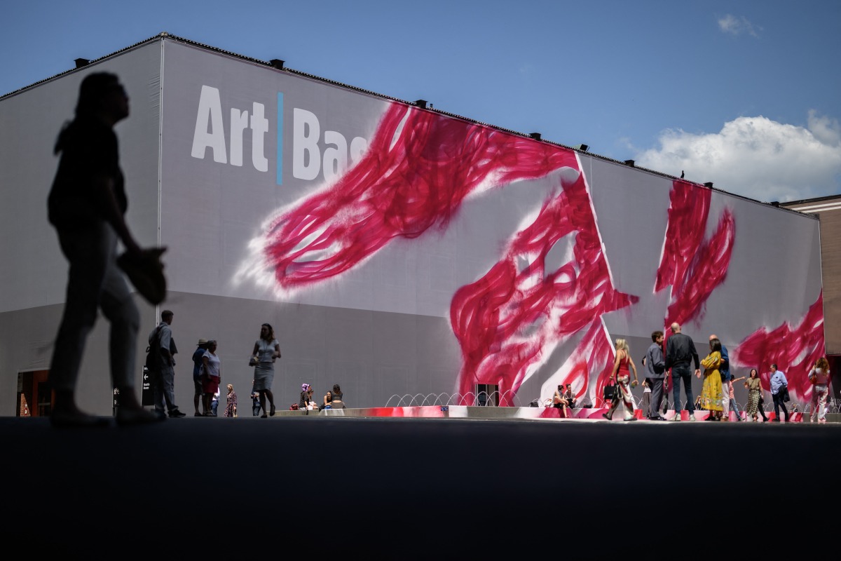 Visitors walk on the artwork 