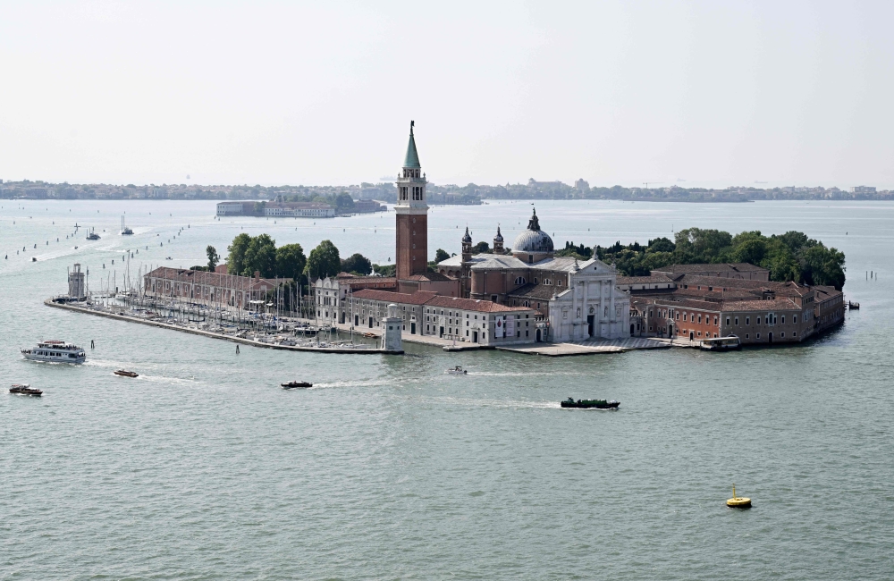 This picture taken on June 23,2025 shows the island of San Giorgio Maggiore, in Venice lagoon, northern Italy. Venice will host the wedding of Amazon Founder and CEO Jeff Bezos and journalist Lauren Sanchez with more than 200 guests expected to attend. (Photo by Stefano Rellandini / AFP)