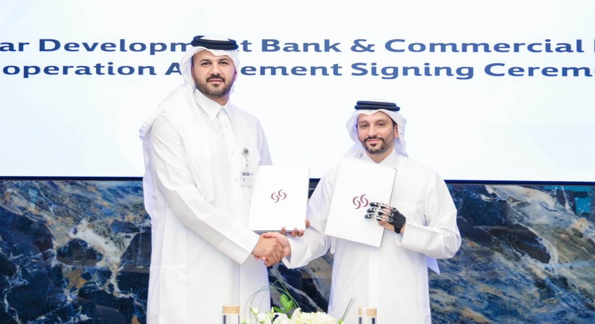 Chief Wholesale and International Banking Officer of Commercial Bank, Fahad Badar, EGM with Executive Director of SME Development at QDB, Dr. Hamad Salem Mejegheer.