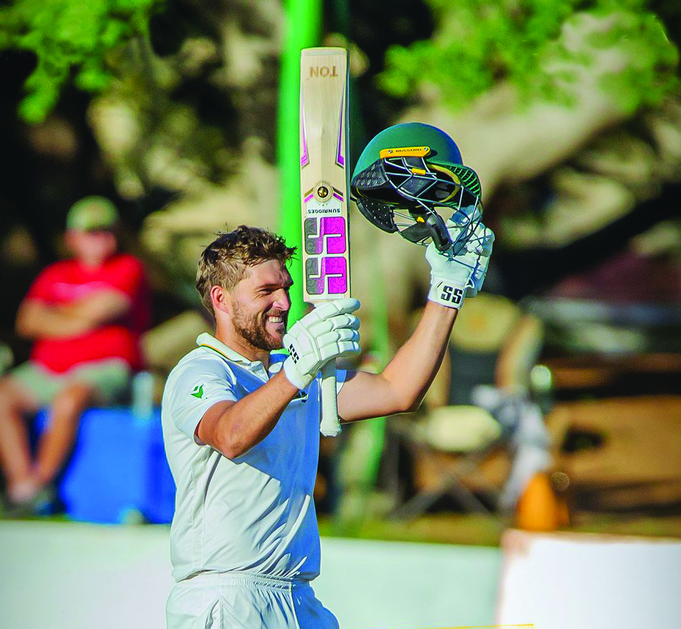 Wiaan Mulder raises the bat after reaching his triple century.