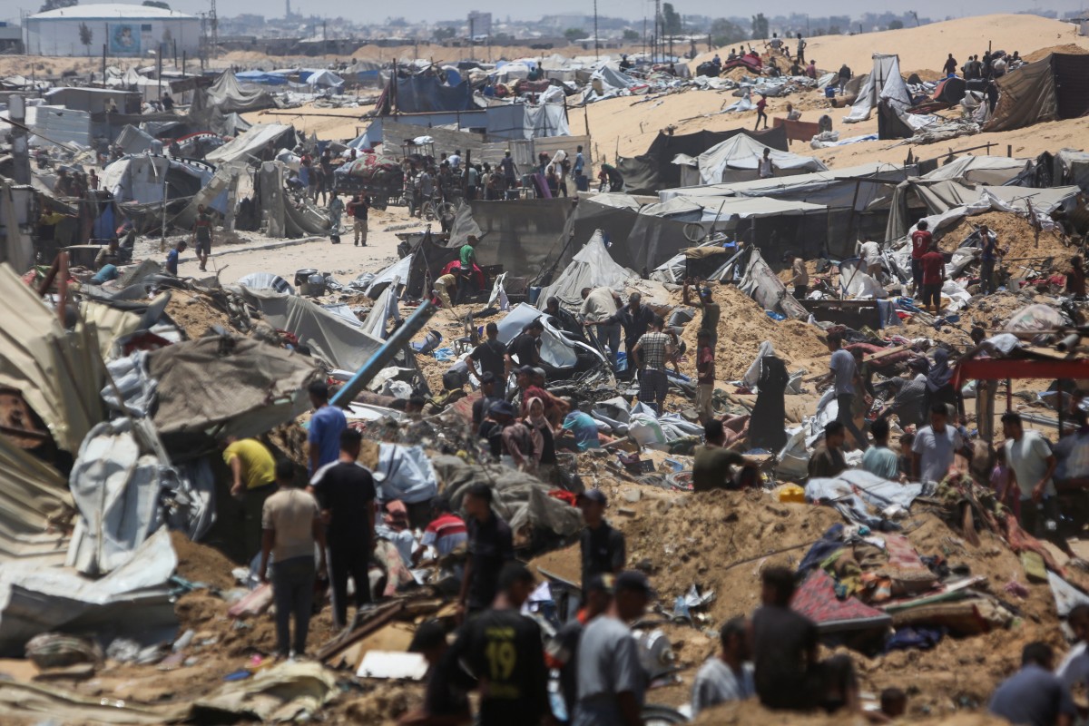 Palestinians inspect the destruction at a makeshift displacement camp following a reported incursion a day earlier by Israeli tanks in the area in Khan Yunis in the northern Gaza strip on July 11, 2025. Photo by AFP.