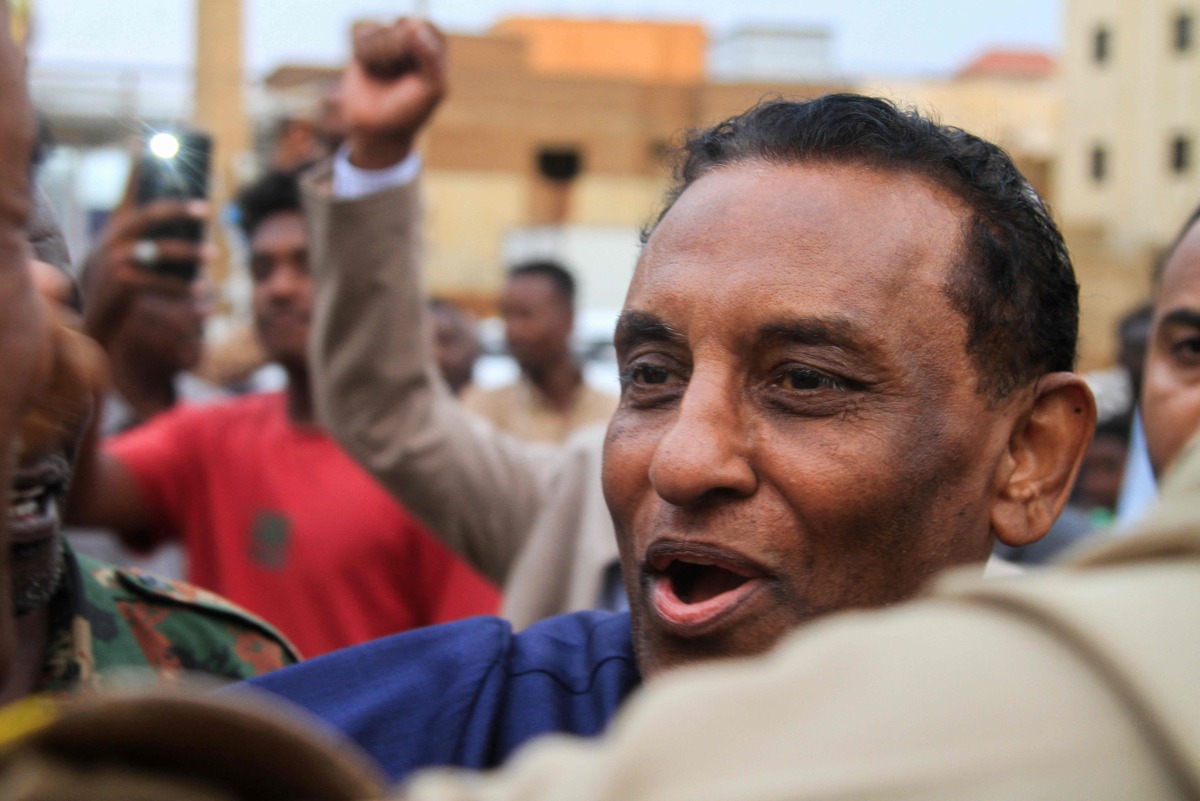 Kamil Idris, a former UN official who was appointed in May as prime minister by Sudan's de facto leader Abdel Fattah al-Burhan, addresses people and local fighters supporting the Sudanese army who came to cheer him on, during a visit in Omdurman on July 19, 2025. (Photo by Ebrahim Hamid / AFP)
