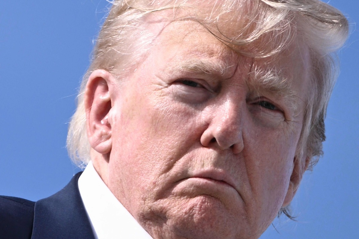 US President Donald Trump boards Air Force One at RAF Lossiemouth, north-east Scotland on July 29, 2025 at the end of his trip to Scotland. (Photo by Brendan SMIALOWSKI / AFP)
