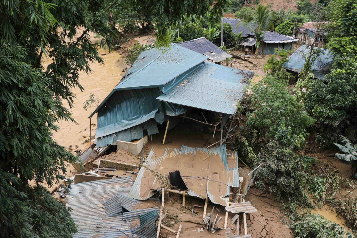 This photo taken by the Vietnam News Agency (VNA) on August 1, 2025 shows a collapsed house due to flooding in northern Vietnam's Dien Bien province. Photo by Trinh Xuan Tu / Vietnam News Agency / AFP