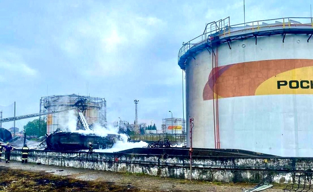 A handout photograph released by the Mayor of Sochi Andrey Proshunin in his Telegram channel on August 3, 2025, shows firefighters working at a fuel depot outside Sochi, after an overnight Ukrainian drone attack. (Photo by Handout / Telegram / t.me/agproshunin / AFP)