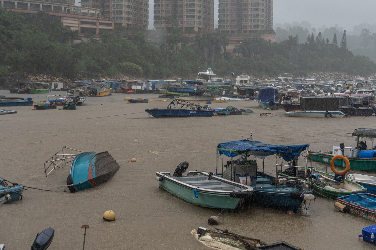 An overturned boat is seen in Tseung Kwan O district in Hong Kong on August 5, 2025. Photo by Yan ZHAO / AFP