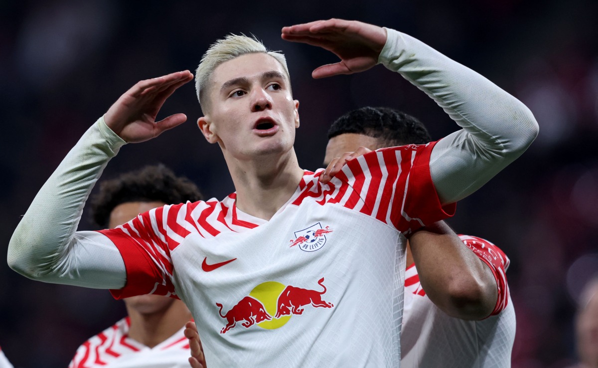 (FILES) Leipzig's Slovenian forward #30 Benjamin Sesko celebrates after scoring the 1-0 opening goal during the UEFA Champions League group G football match between RB Leipzig and Young Boys in Leipzig, eastern Germany, on December 13, 2023. (Photo by Ronny Hartmann / AFP)
