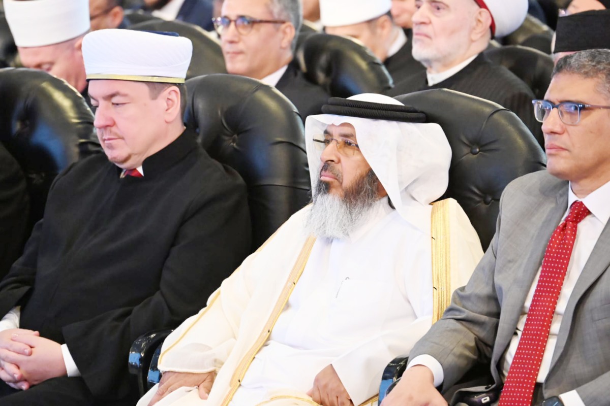 Assistant Undersecretary of the Ministry of Awqaf and Islamic Affairs, Khalid bin Shaheen Al Ghanim, and other delegates at the conference.