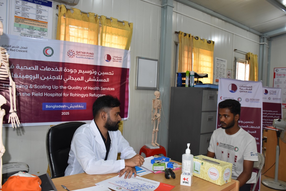 A healthcare official attending to a patient at the field hospital in Bangladesh.