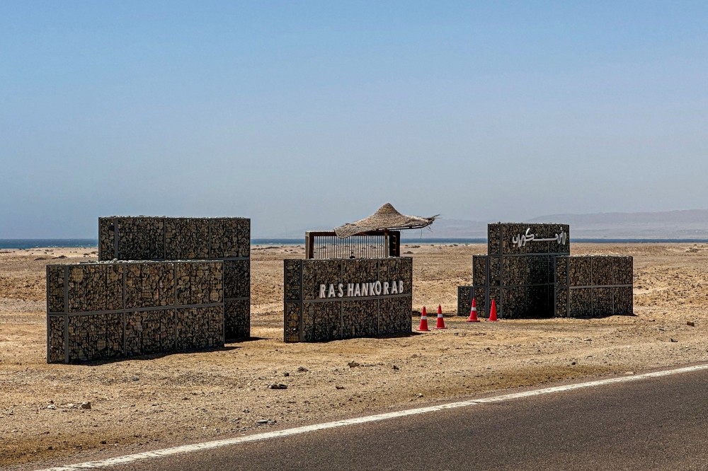 (Files) A sign reads Ras Hankorab along the beach in the Red Sea Wadi Al-Gemal protectorate in southern Egypt on May 28, 2025. (Photo by Khaled Desouki / AFP)