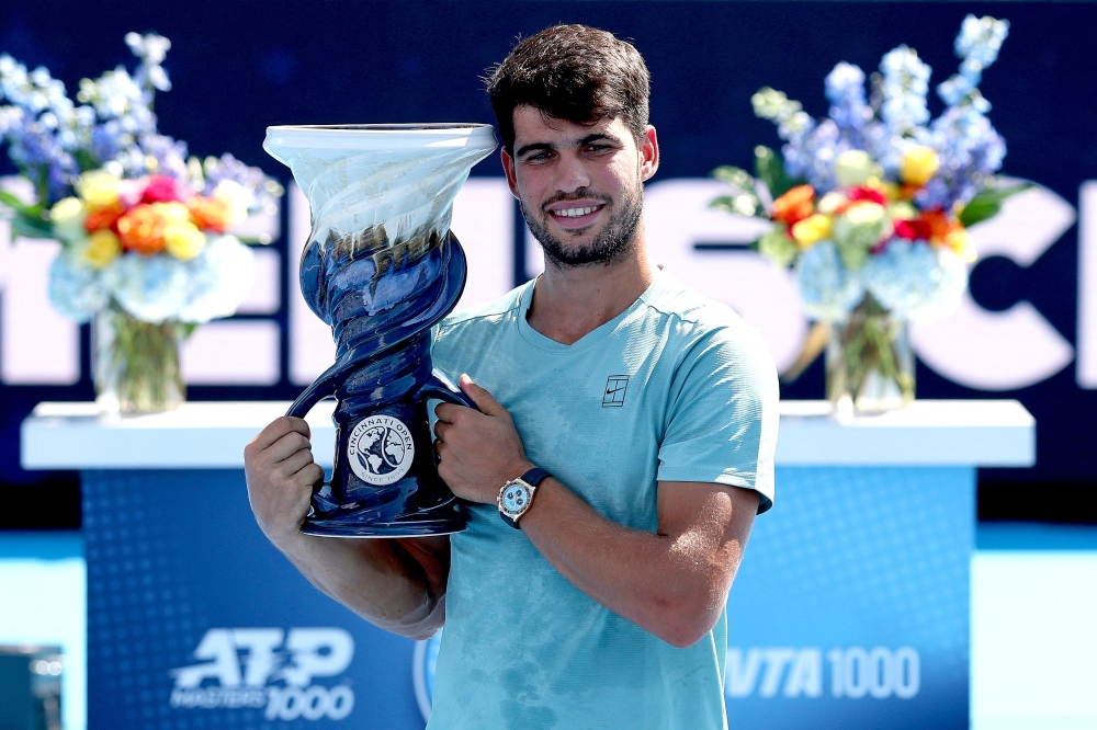Carlos Alcaraz of Spain poses with the Rookwood Cup after his win over Jannik Sinner of Italy during the men's final of the Cincinnati Open at Lindner Family Tennis Center in Mason, Ohio, on August 18, 2025. (Photo by Matthew Stockman/Getty Images/AFP)