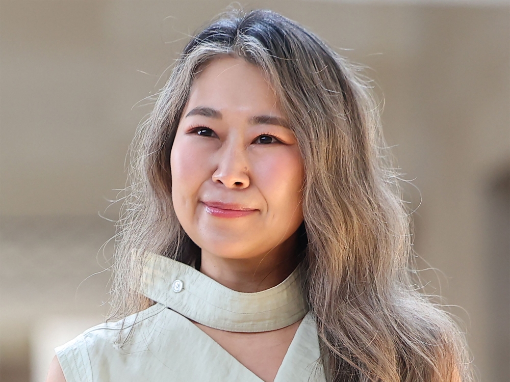 This picture taken on August 21, 2025 shows Korean Canadian director Maggie Kang, who created and co-directed Netflix's currently most popular animated film 