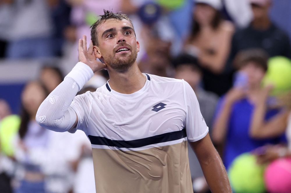 Benjamin Bonzi of France celebrates after defeating Daniil Medvedev on Day One of the 2025 US Open on August 24, 2025. Elsa/Getty Images/AFP