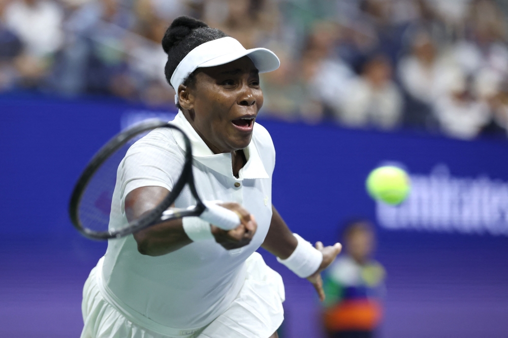 Venus Williams of the United States returns a shot against Karolina Muchova of Czech Republic on August 25, 2025. Elsa/Getty Images/AFP