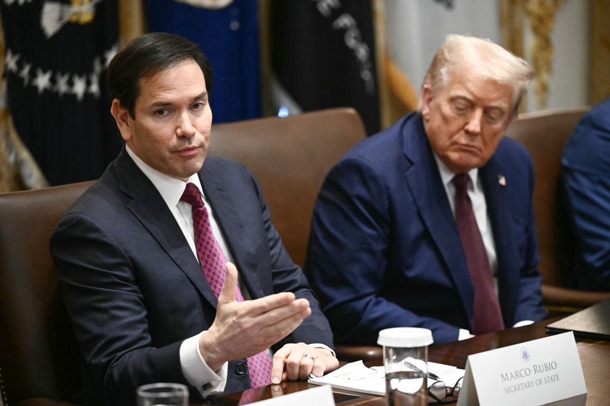 US President Donald Trump looks on as US Secretary of State Marco Rubio speaks during a cabinet meeting in the Cabinet Room of the White House in Washington, DC, on August 26, 2025. (Photo by Mandel NGAN / AFP)