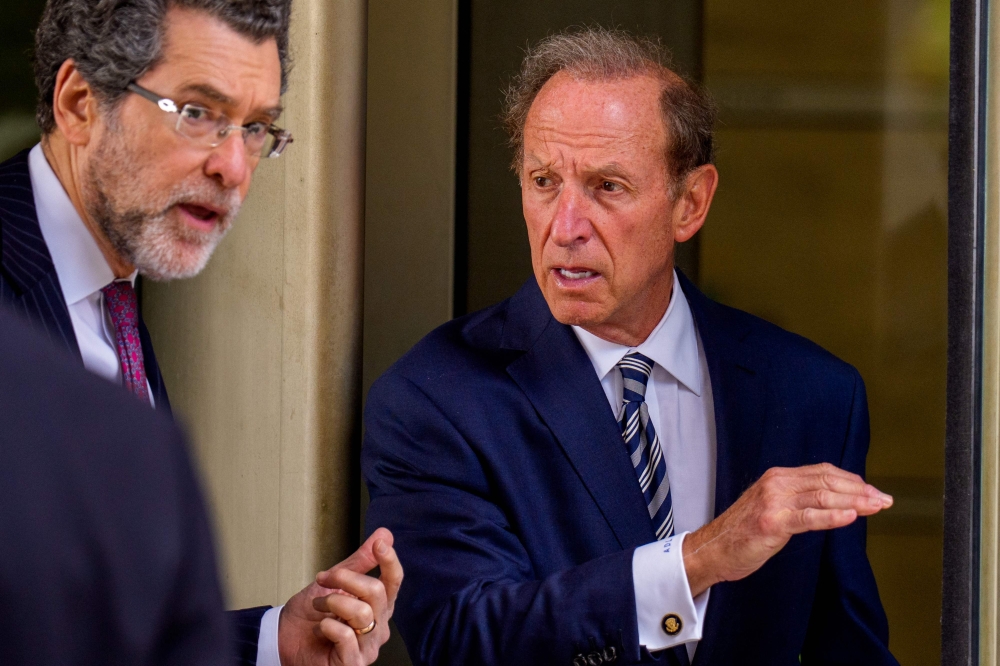 Attorneys Norman Eisen (left) and Abbe Lowell, representing Federal Reserve Governor Lisa Cook, depart federal court on August 29, 2025 in Washington, DC. (Photo by Andrew Harnik/Getty Images/AFP)