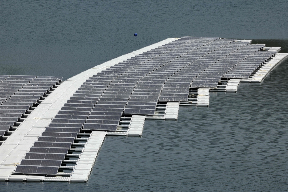 A floating photovoltaic solar installation in put in place on the Oued Rmel dam, as part of a solar pannel farm near the Tanger Med port in the province of Fahs-Anjra, west of the city of Tangiers on August 7, 2025. (Photo by Abdel Majid Bziouat / AFP)