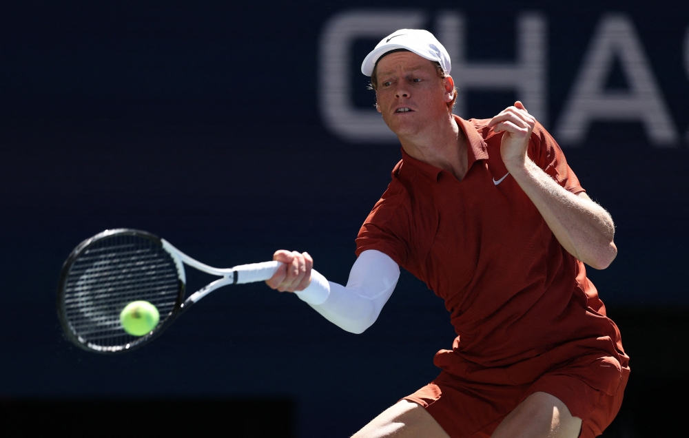 Jannik Sinner of Italy plays a forehand against Denis Shapovalov of Canada on August 30, 2025. Clive Brunskill/Getty Images/AFP
