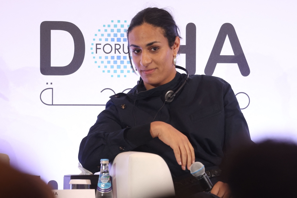 Algerian gold medalist boxer Imane Khelif listens to the translation during the Doha Forum in the Qatari capital on December 7, 2024.  (Photo by Karim Jaafar / AFP)