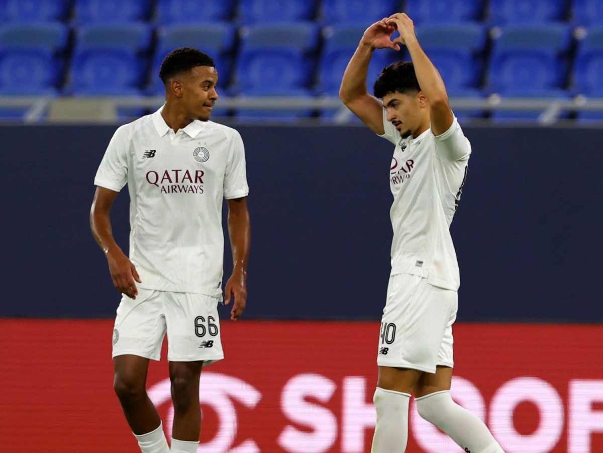 Al Sadd’s Yamaan Jarrar (right) celebrates with teammate Abdulrahman Bakri Al-Ameen during the match. 