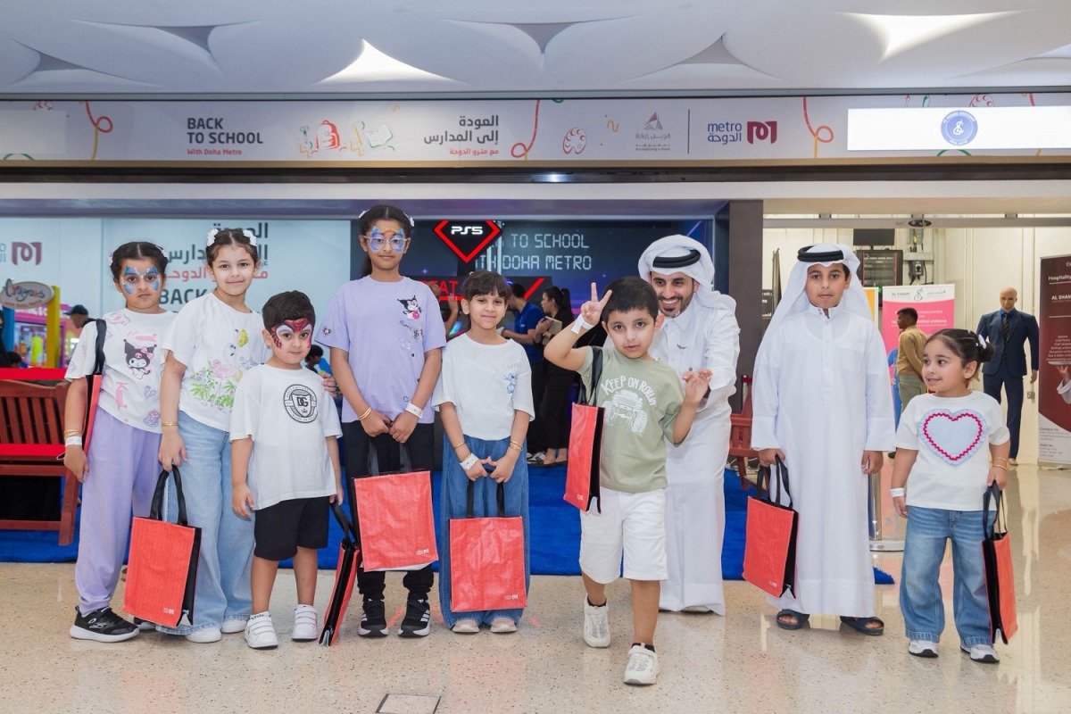 Children with gifts at the Back-to-School event by Qatar Rail.