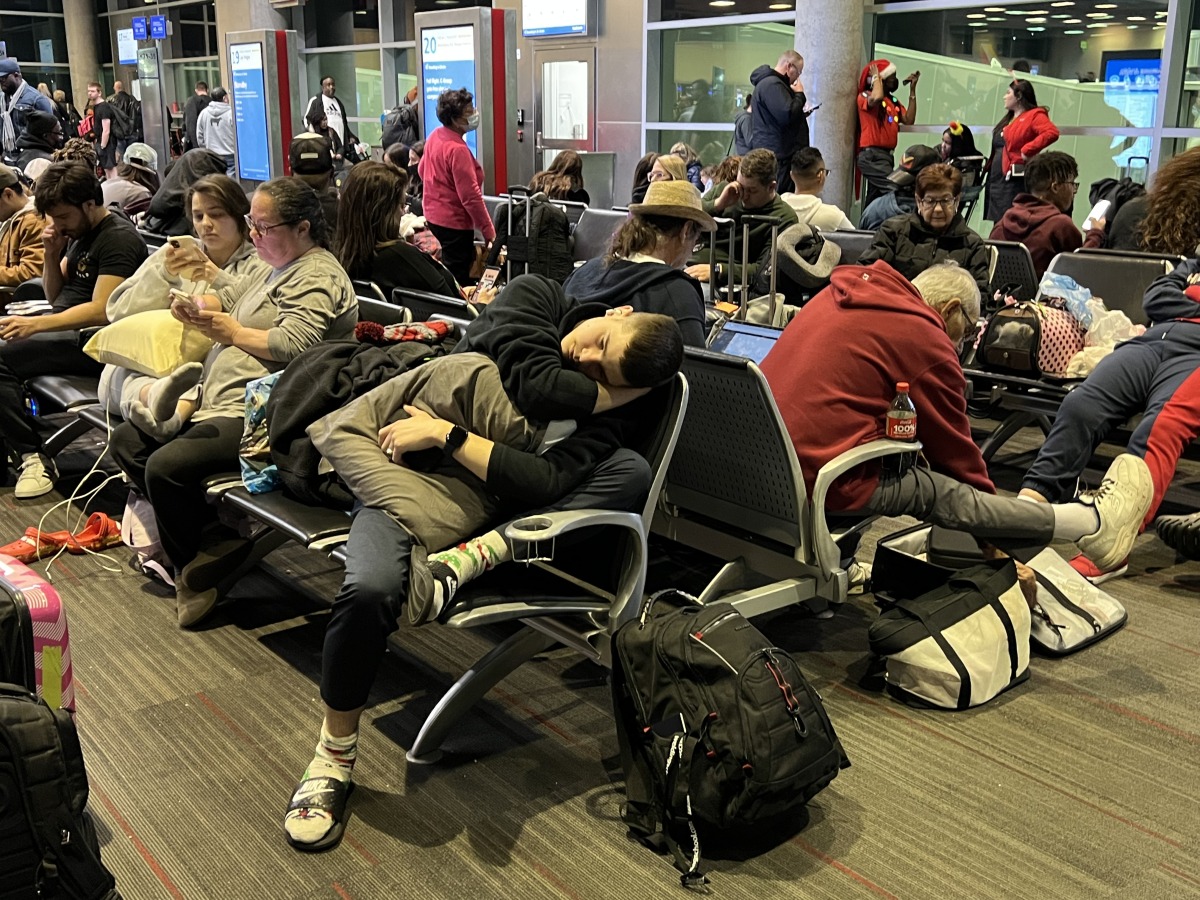 Passengers wait to board a Southwest flight in Dallas on Dec. 25, 2022, after the flight was delayed six hours because of a shortfall of flight attendants. The flight was then canceled. Photo credit: John McDonnell/The Washington Post
