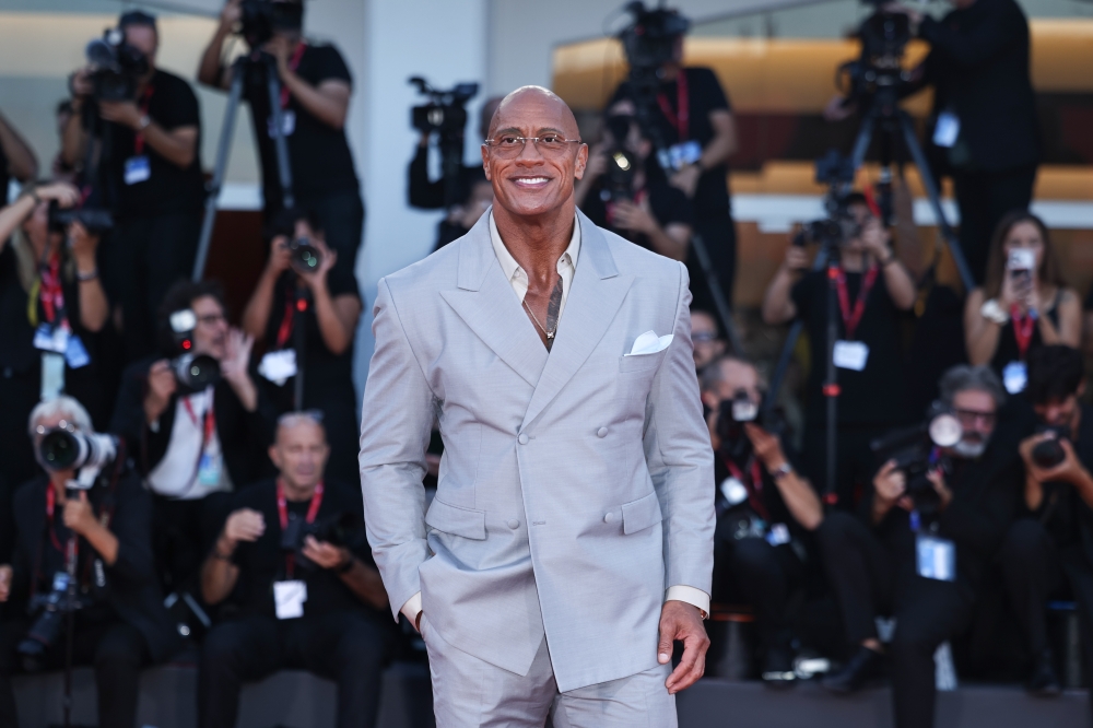 Dwayne Johnson poses at the red carpet before the premiere of the film 