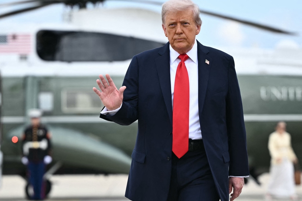US President Donald Trump walks to board Air Force One at Joint Base Andrews, Maryland, on September 7, 2025. Trump is heading to New York to attend the US Open men's tennis final. (Photo by Mandel Ngan / AFP)
