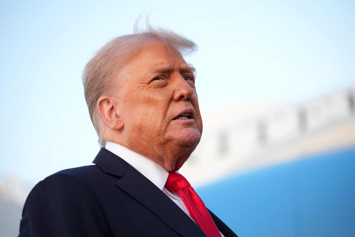 U.S. President Donald Trump speaks to reporters after stepping off Air Force One on September 7, 2025 at Joint Base Andrews, Maryland. Photo by Kevin Dietsch / GETTY IMAGES NORTH AMERICA / Getty Images via AFP