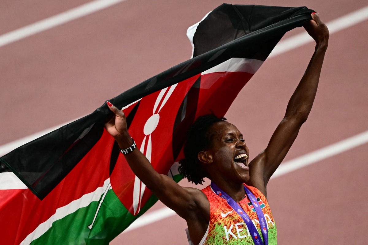 Kenya's Faith Kipyegon celebrates after winning the women's 1500m final during the World Athletics Championships in Tokyo on September 16, 2025. (Photo by Yuichi YAMAZAKI / AFP)
