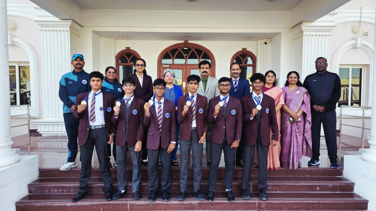 Medal winners with school officials.