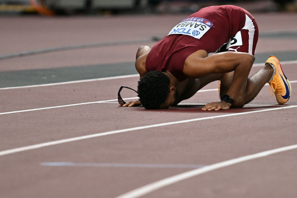 Qatar's athlete Abderrahman Samba reacts after competing in the men's 400m hurdles final during the World Athletics Championships in Tokyo on September 19, 2025. (Photo by Andrej ISAKOVIC / AFP)
