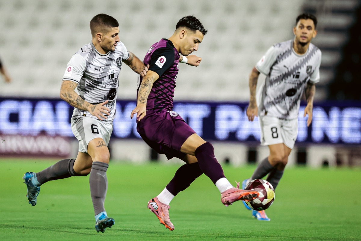 Al Sadd's Agustín Soria and Al Duhail's Marco Verratti (left) vie for the ball.