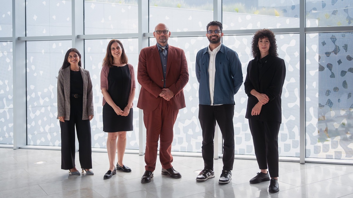 Dean Marwan M Kraidy with new faculty members.