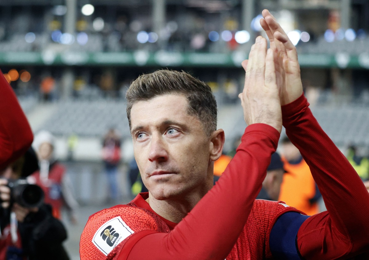 Poland's forward #09 Robert Lewandowski celebrates after the 2026 World Cup qualifiers Europe zone group G football match between Lithuania and Poland on October 12, 2025 in Kaunas, Lithuania. (Photo by Petras Malukas / AFP)