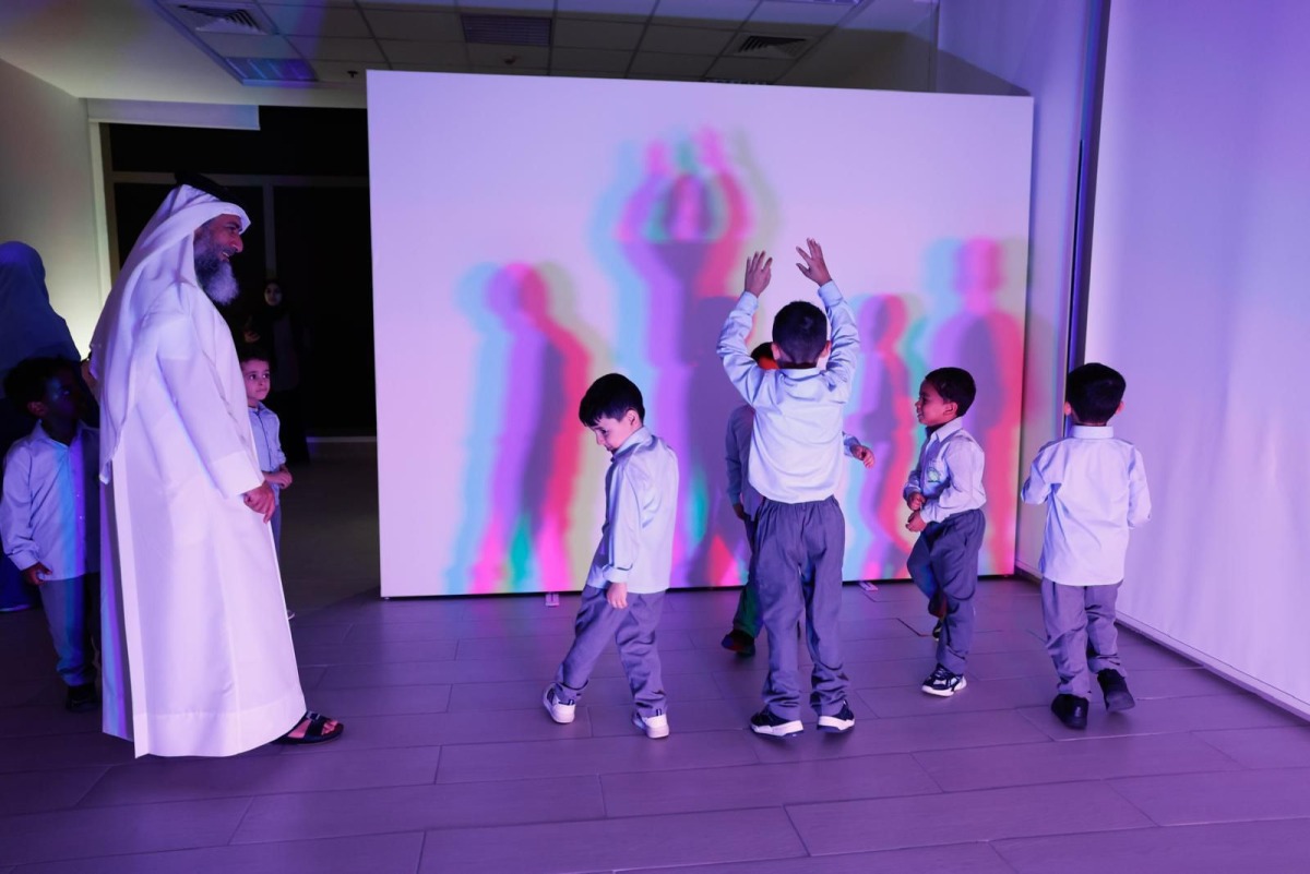 Children enjoy a show at the Light Exhibition.